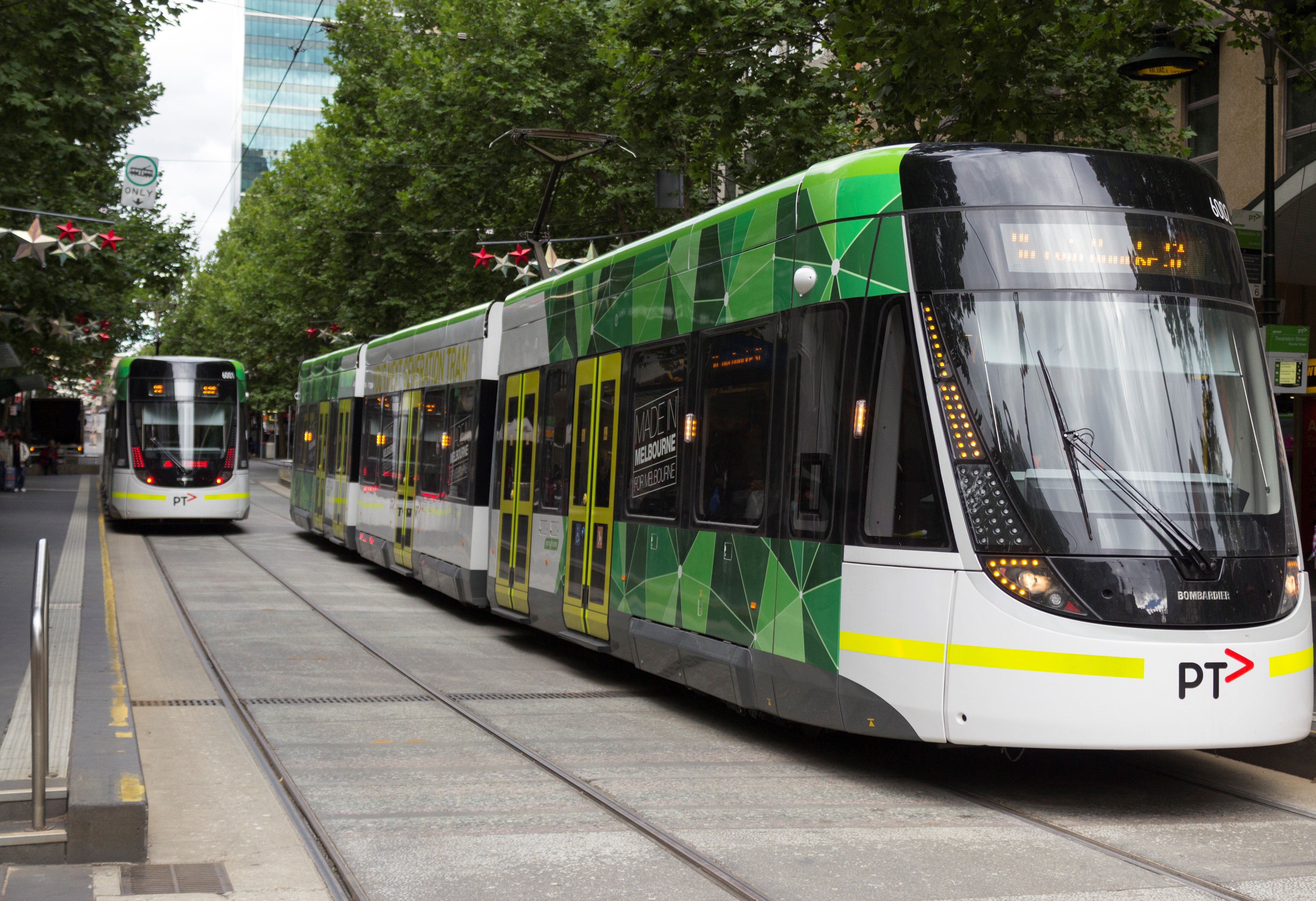 E_6001_and_E_6002_(Melbourne_trams)_in_Bourke_St_on_route_96,_2013